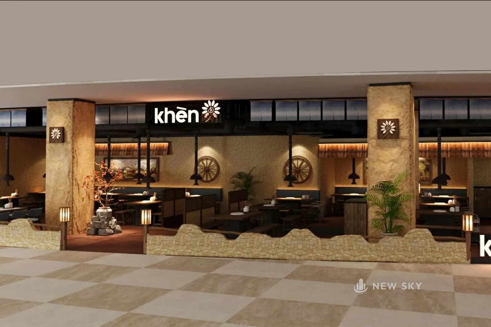 Phối cảnh mặt tiền nhà hàng Khèn Nướng Sapa tại Aeon Mall Hạ Long nhìn từ hành lang lát gạch: mặt tiền mở, ngăn với lối đi bằng hàng rào thấp đỉnh lượn mặt sần màu vàng đất, hai cột lớn gắn biển hình bông hoa, biển chữ "khèn" kèm bông hoa trên cao, bên trong là các bàn có chụp hút đen, bánh xe gỗ và tranh phong cảnh treo tường.